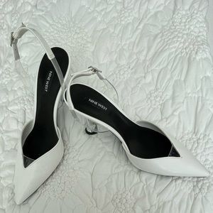 Nine West white leather sling backs.  Silver heal, white leather and clear strap
